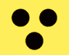 three black dots on a yellow background